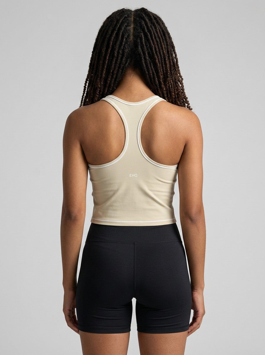 Back view of EHG SmartWellness beige yoga tank top with racerback design, white trim, and topstitching on a model.