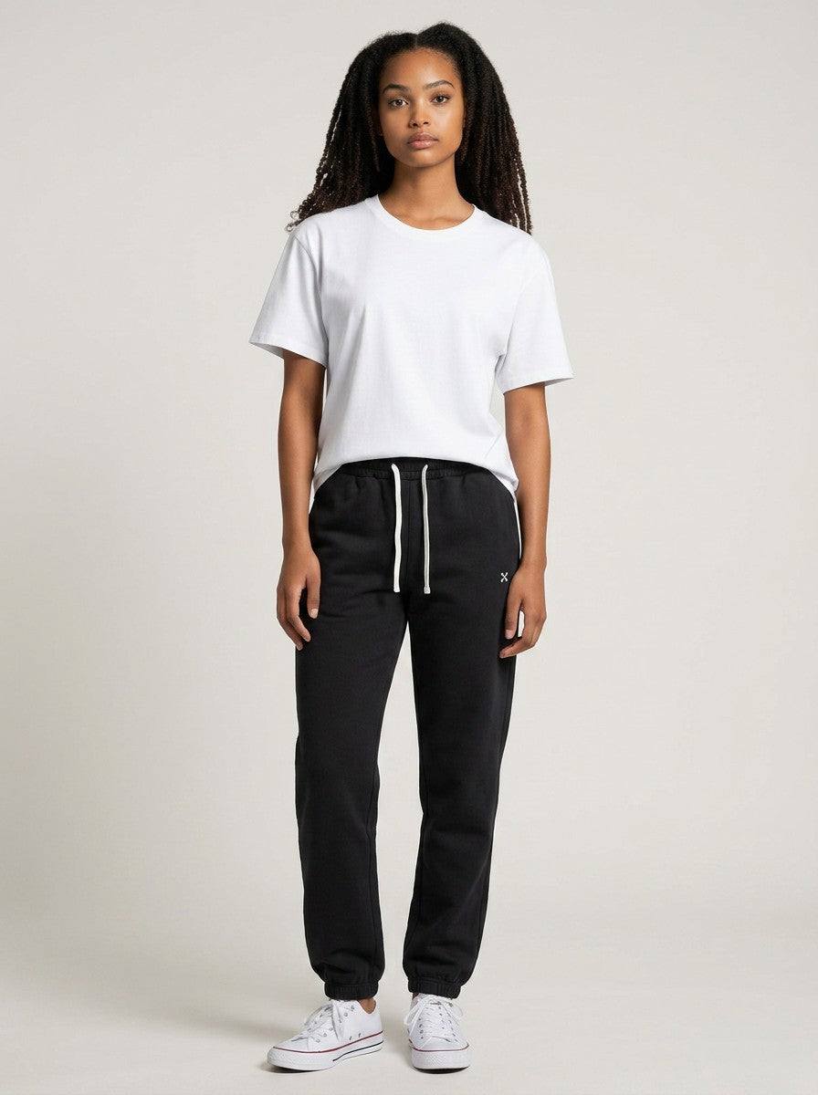 Model wearing EHG SmartWellness black heavyweight cotton sweatpants with a white drawstring and relaxed fit