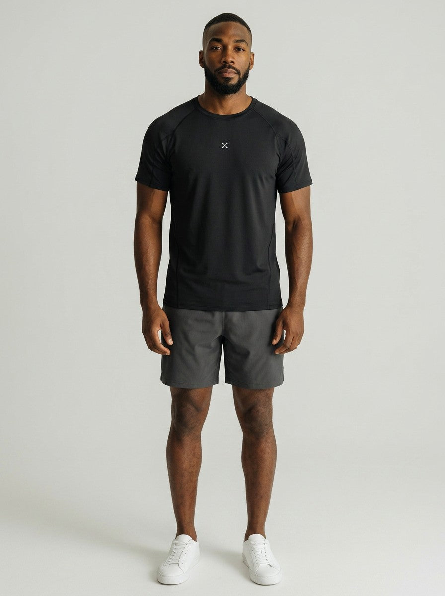 A model wearing an EHG SmartWellness black performance training t-shirt with contrast stitching and bodycon fit.