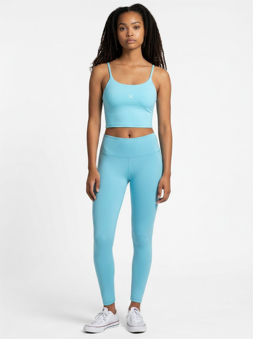 EHG SmartWellness light blue spaghetti strap sports bra and matching leggings worn by a model on a white background.