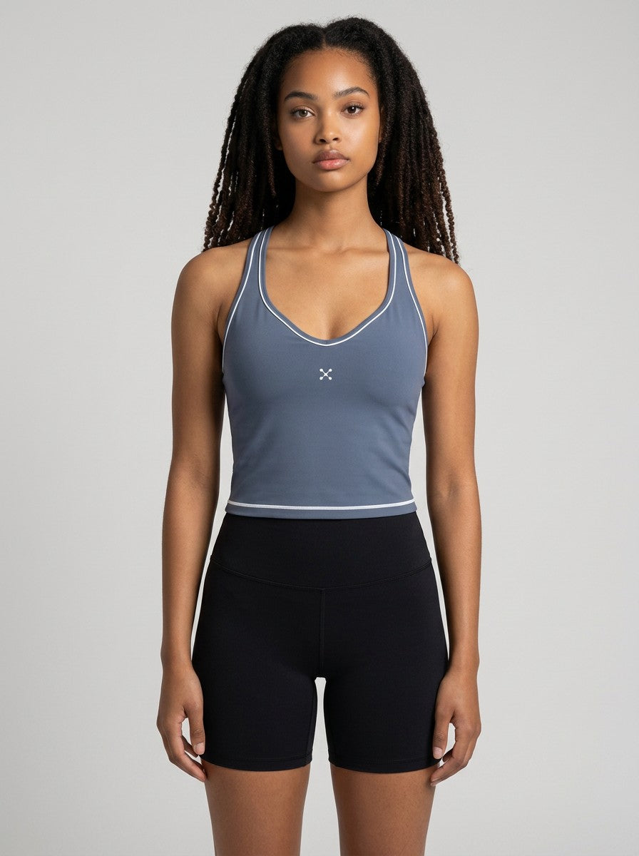EHG SmartWellness blue yoga tank top with U-neck, skinny straps, and white topstitching on a model.