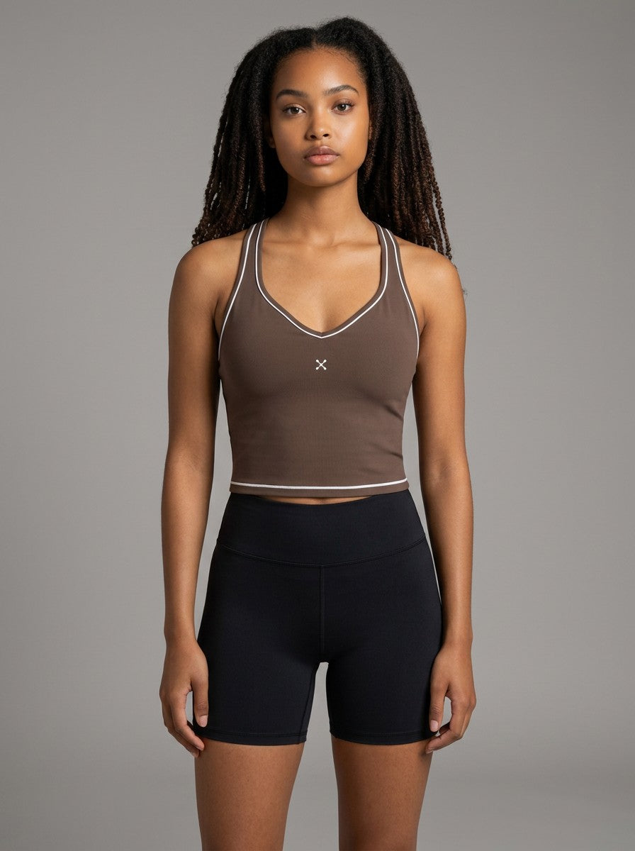 Model wearing EHG SmartWellness brown yoga tank top with white topstitching, U-neck, and skinny straps.