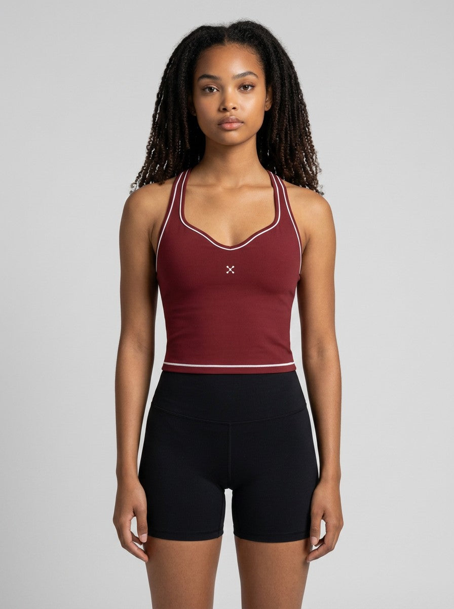 Model wearing EHG SmartWellness burgundy yoga tank top with white topstitching, U-neck, and skinny straps.