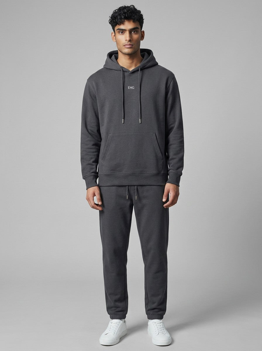 A man wearing an EHG SmartWellness dark grey heavyweight cotton hoodie with a relaxed fit and front kangaroo pocket.