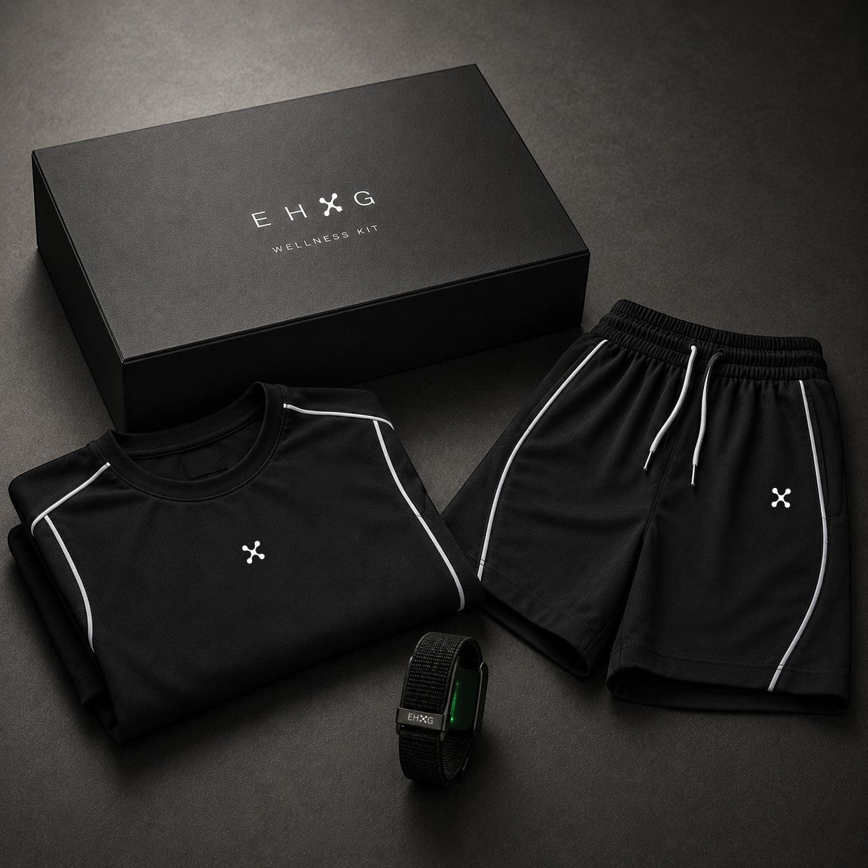 EHG SmartWellness Everyday Kit featuring a black boxy piping t-shirt, drawstring shorts, and a smart fitness band.