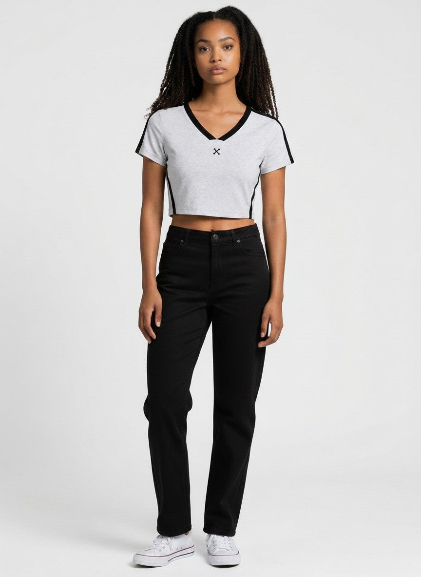 Model wearing EHG SmartWellness slim fit grey colour block V-neck crop top with black side stripes and jeans.