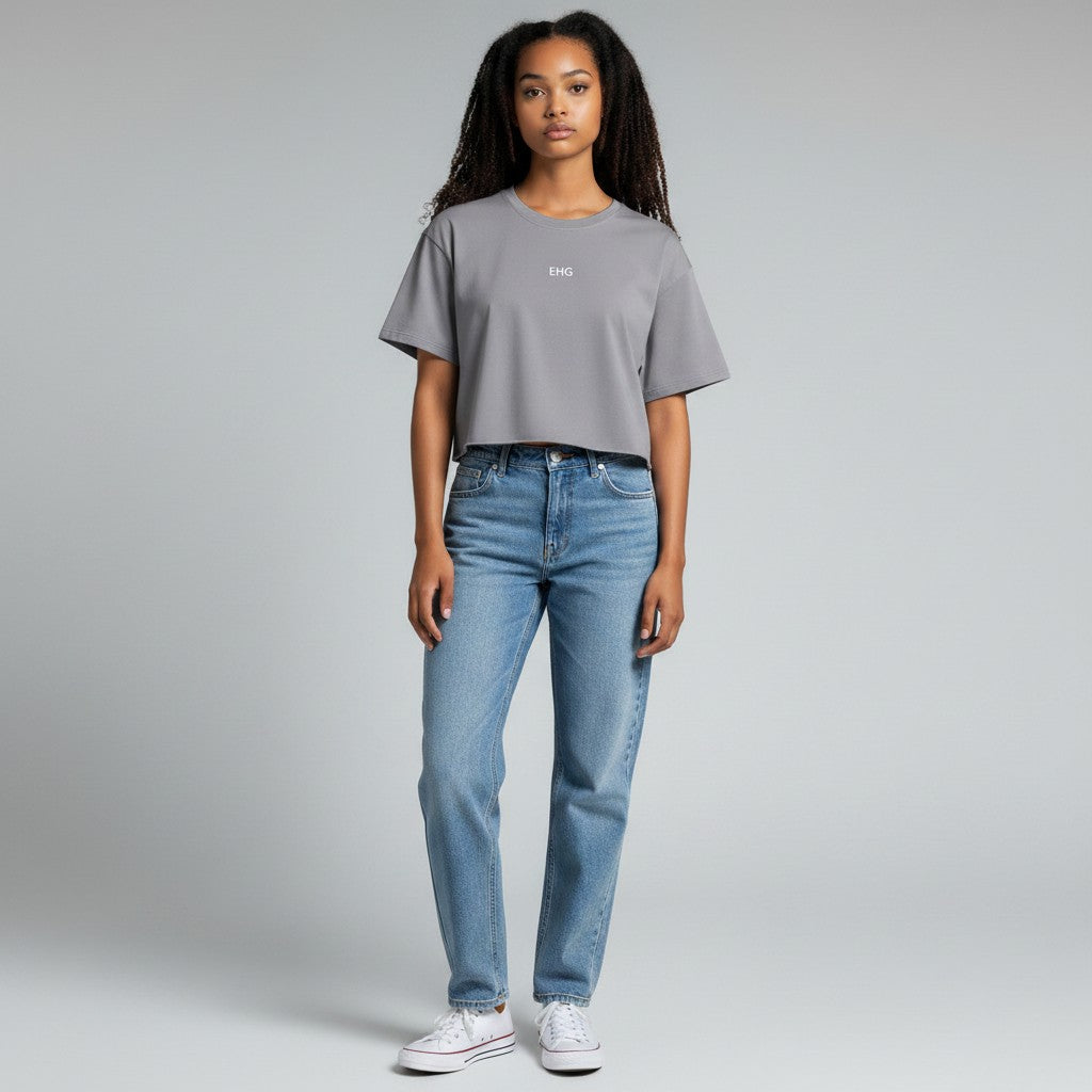 Model wearing an EHG SmartWellness grey snow-washed cotton crop top with dropped shoulders and raw-edge hem.