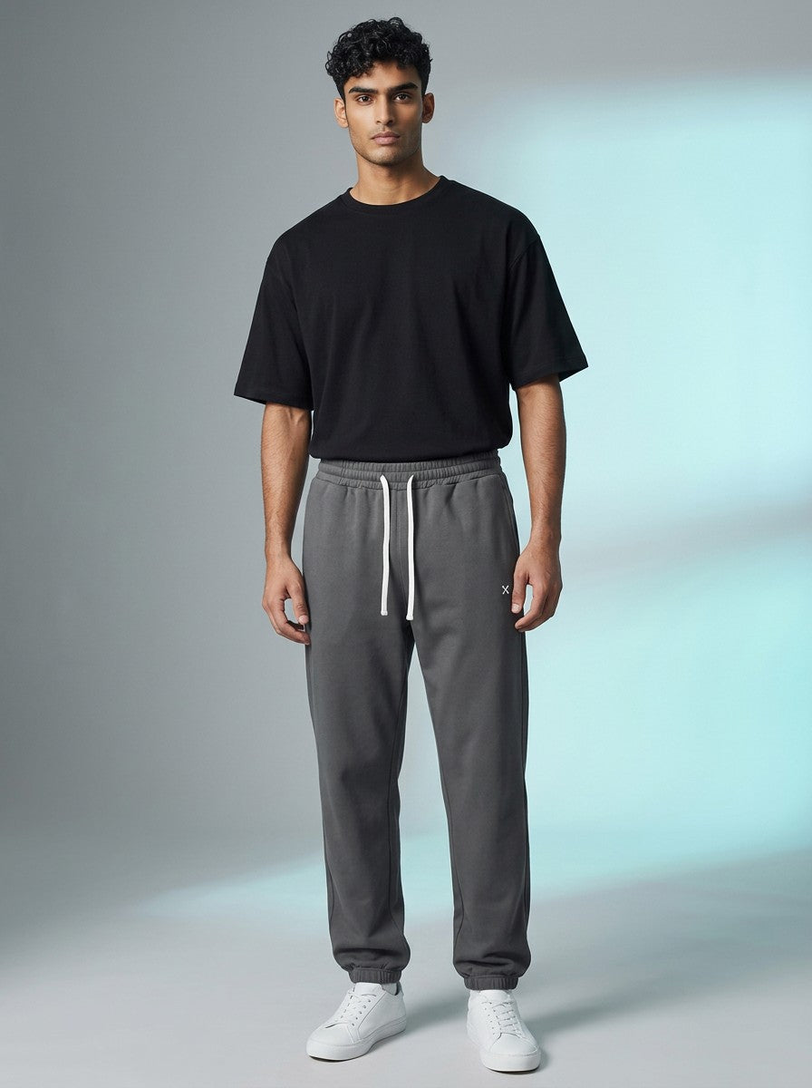A model wearing EHG SmartWellness grey heavyweight cotton sweatpants with a drawstring waist and relaxed fit.