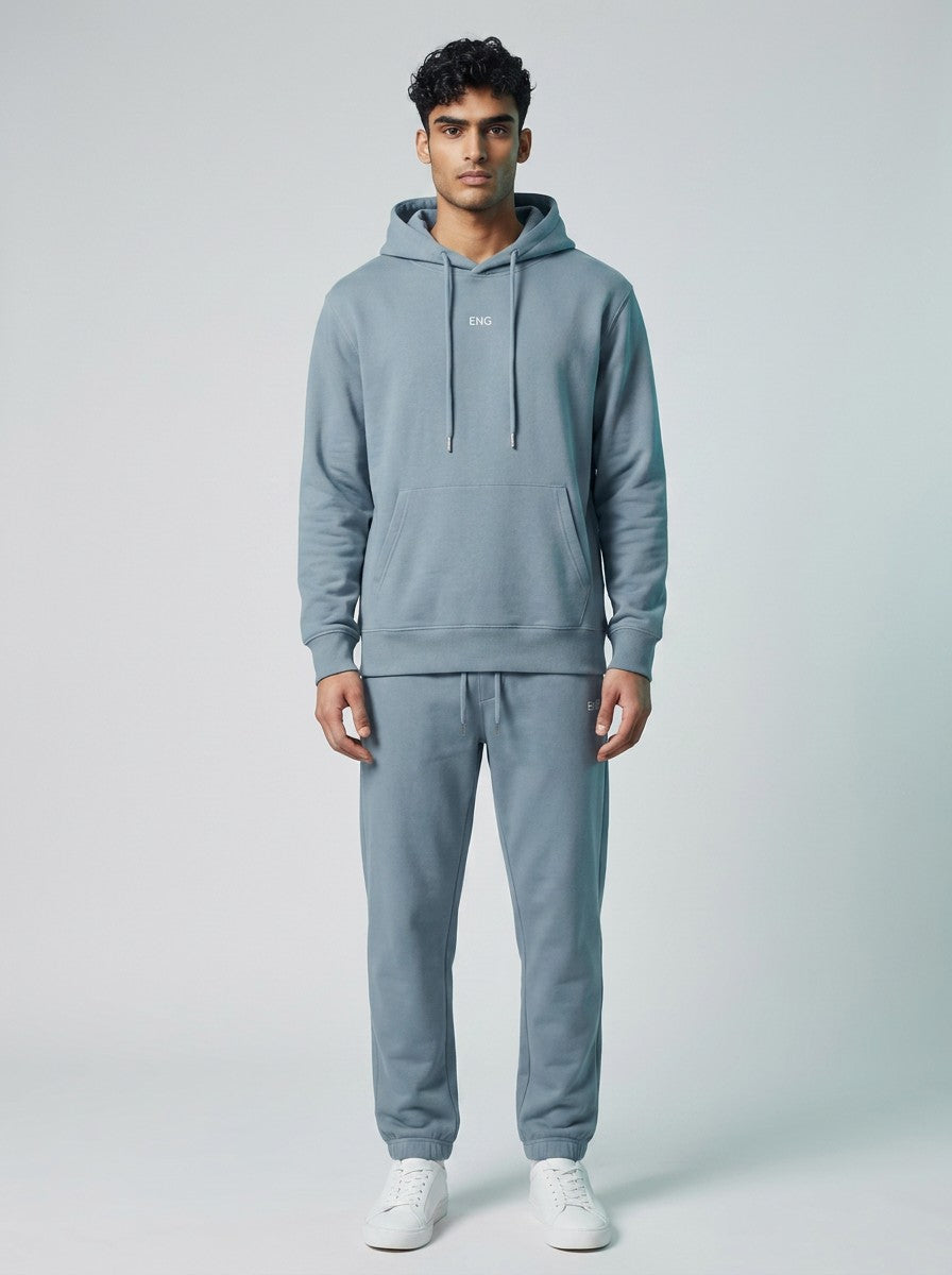 Model wearing EHG SmartWellness haze blue heavyweight cotton hoodie and matching joggers with a relaxed fit.