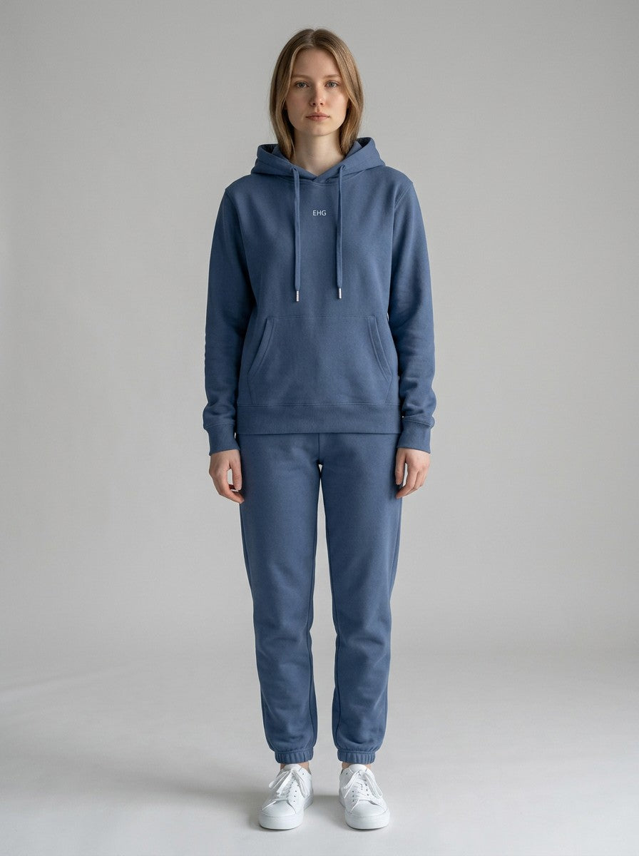 Model wearing EHG SmartWellness Haze Blue cotton hoodie and matching joggers with drop shoulders and front pocket.