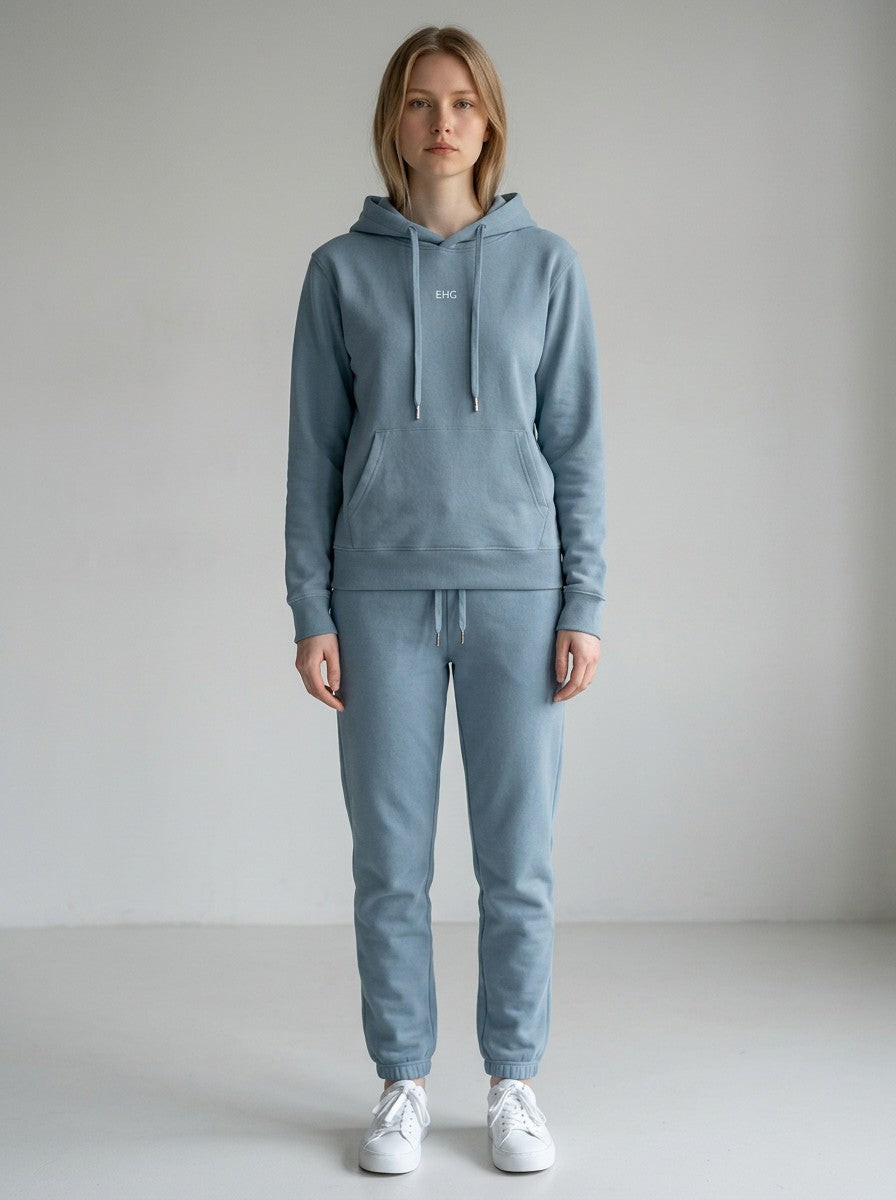 Model wearing EHG SmartWellness haze blue cotton hoodie and matching joggers in a relaxed, comfortable fit.