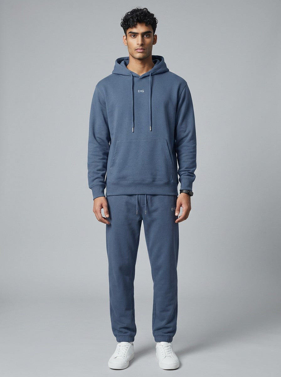 Model wearing EHG SmartWellness Haze Blue heavyweight cotton hoodie with drop shoulders and front pocket