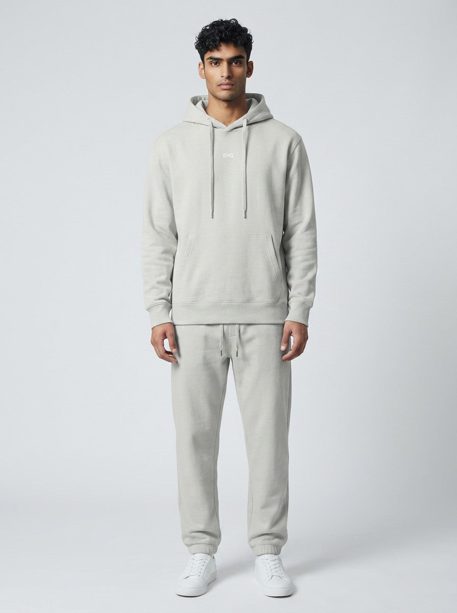 Model wearing EHG SmartWellness hemp ash cotton hoodie and matching joggers with a relaxed drop shoulder fit.