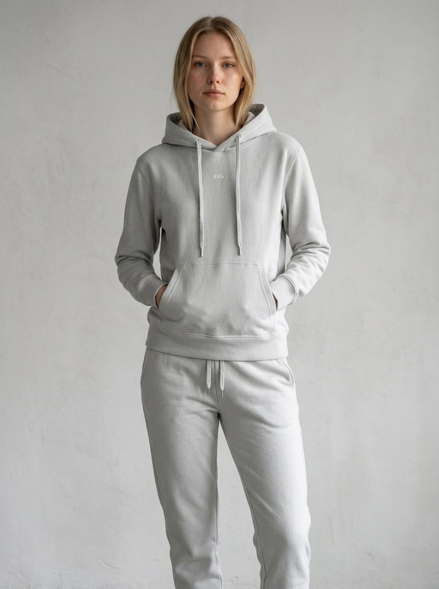 Model wearing an EHG SmartWellness hemp ash cotton hoodie with a relaxed fit, drop shoulders, and front pocket.