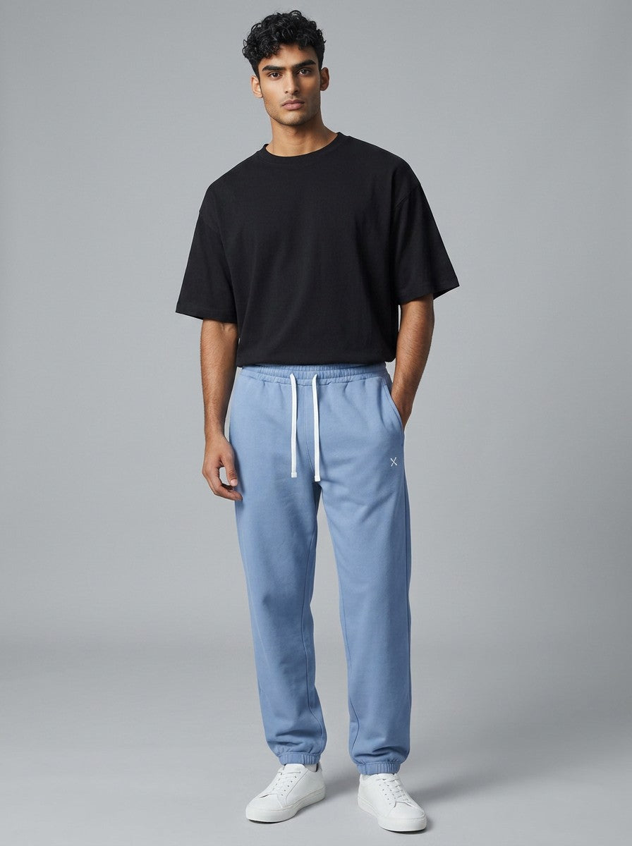 EHG SmartWellness unisex light blue heavyweight cotton sweatpants with a drawstring waist worn by a male model.