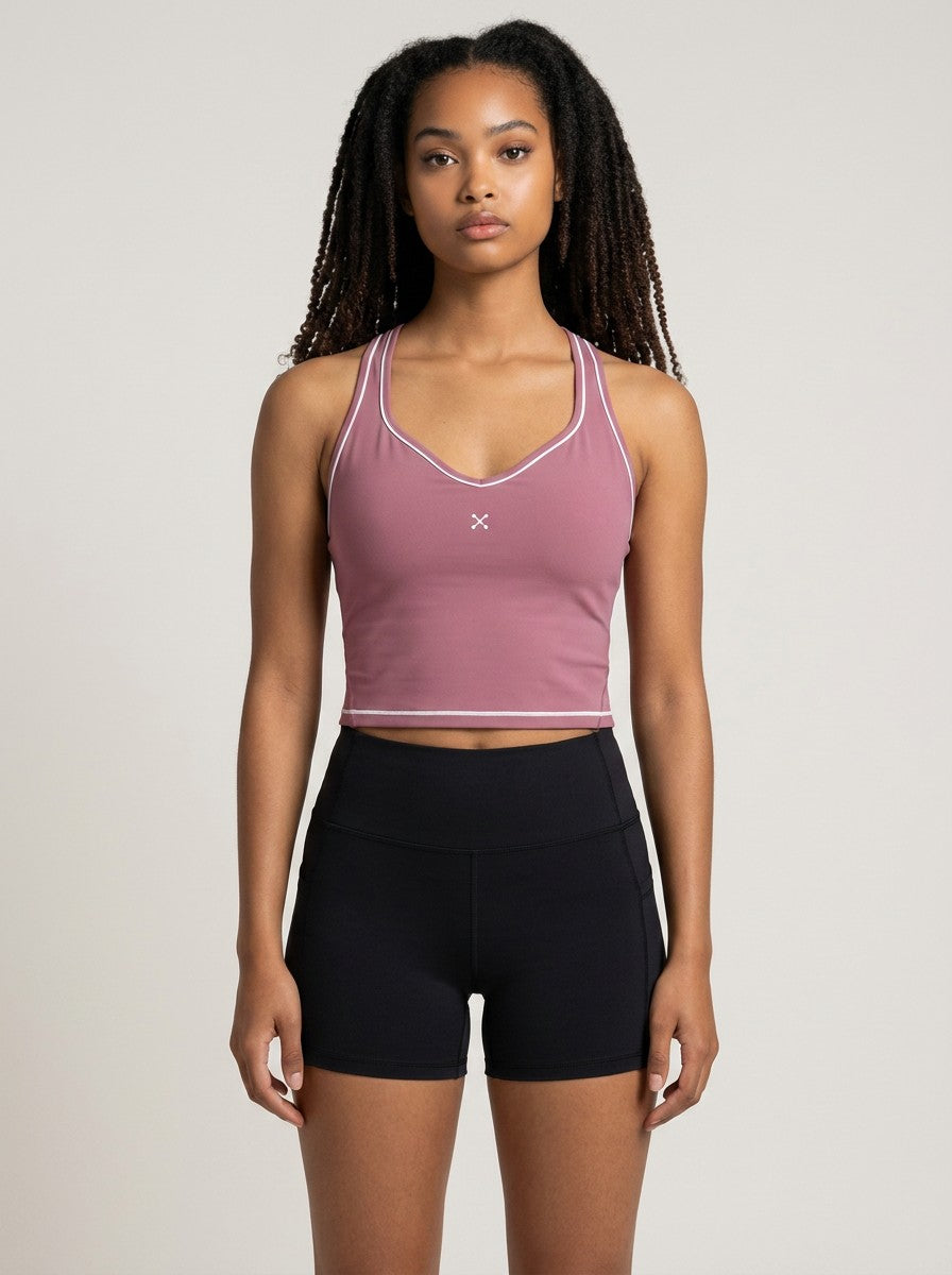 Model wearing EHG SmartWellness mauve yoga tank top with white topstitching, U-neck, and skinny straps.