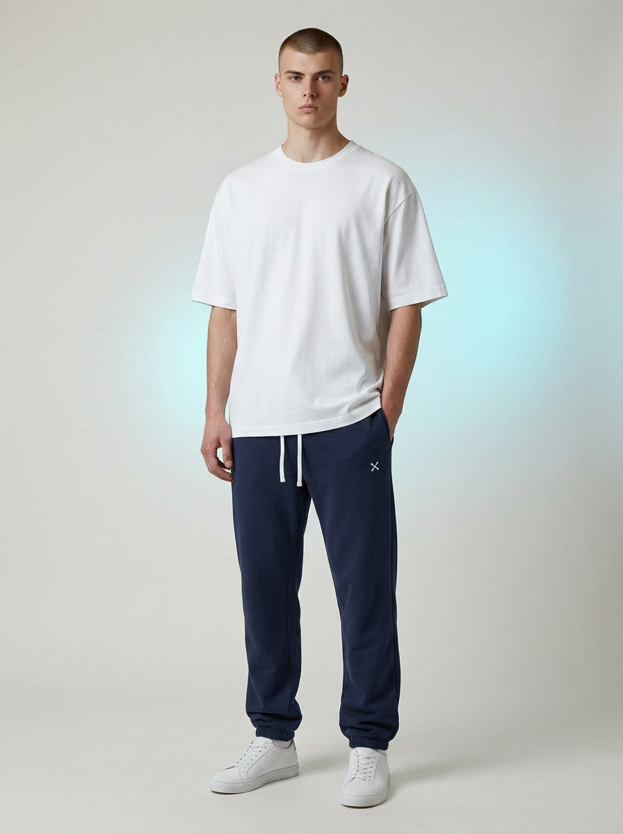 Model wearing EHG SmartWellness navy blue heavyweight cotton sweatpants with a white drawstring and relaxed fit.
