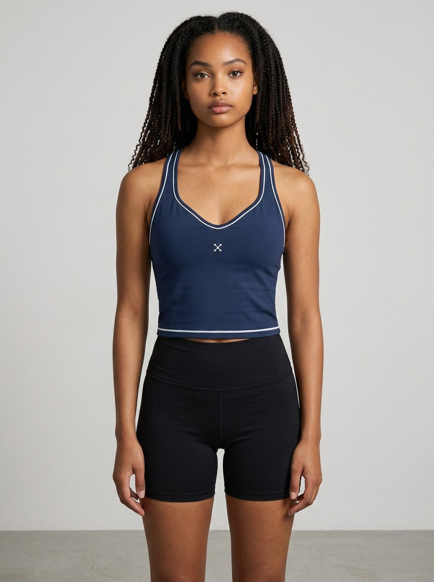 Model wearing EHG SmartWellness navy blue yoga tank top with white topstitching, U-neck, and skinny straps.