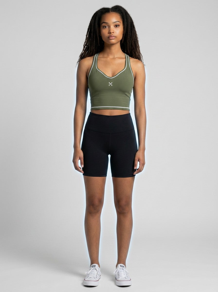 EHG SmartWellness olive green yoga tank top with U-neck, skinny straps, and white topstitching on a female model.