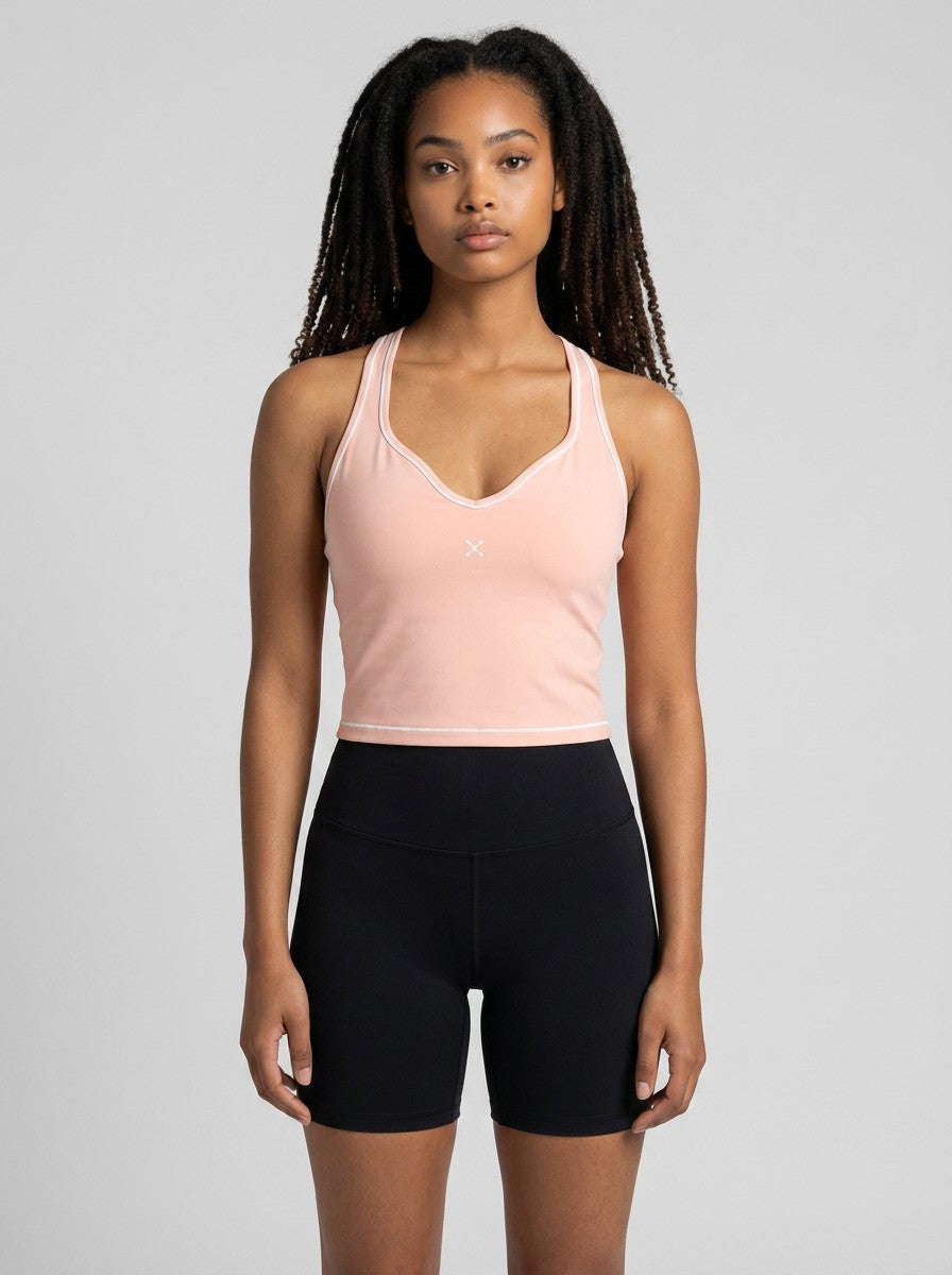 EHG SmartWellness women's peach yoga tank top with U-neck, skinny straps, and white topstitching detail on a model.