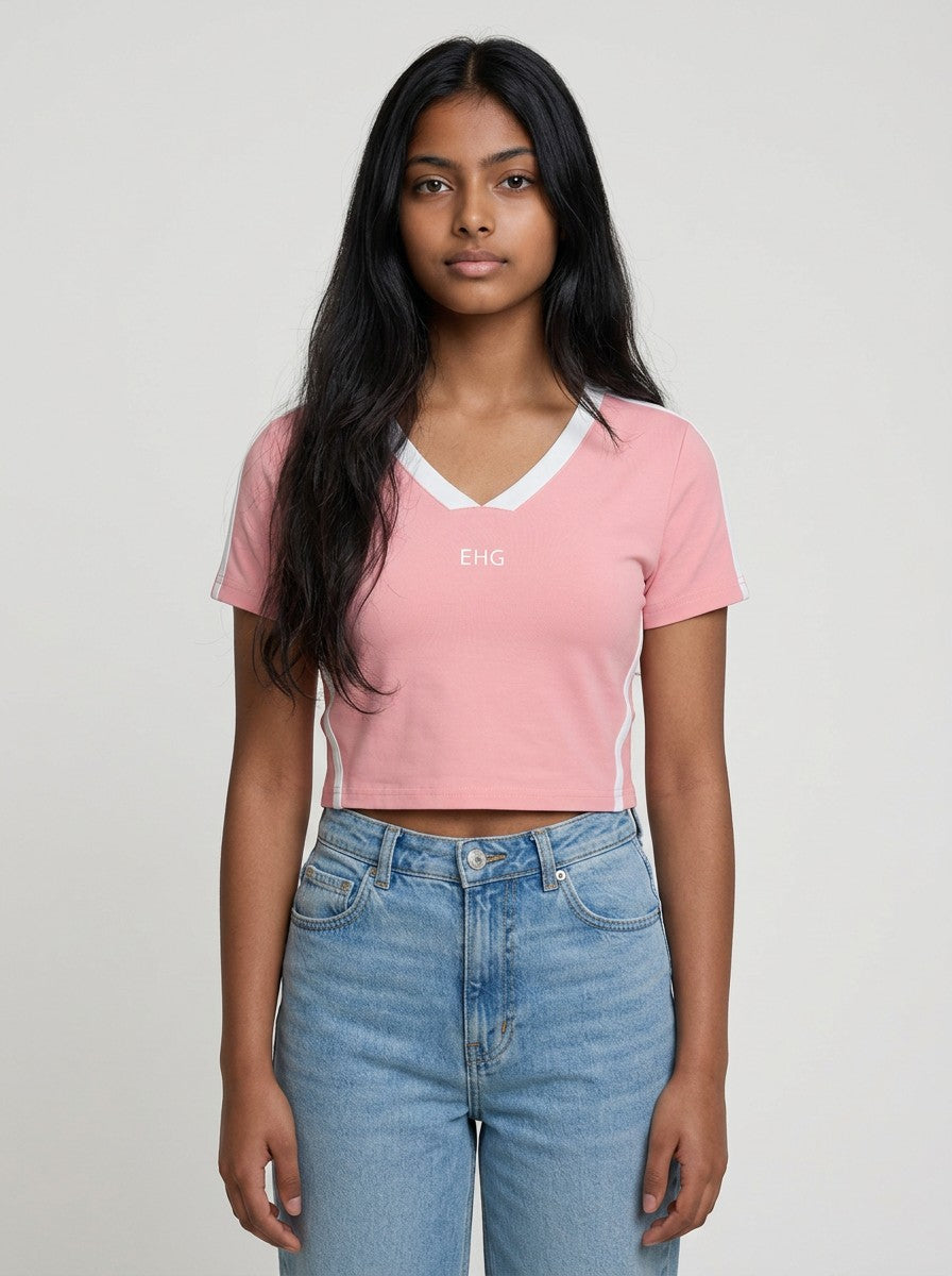 A model wearing an EHG SmartWellness pink slim fit V-neck t-shirt with white trim and side stripe details.