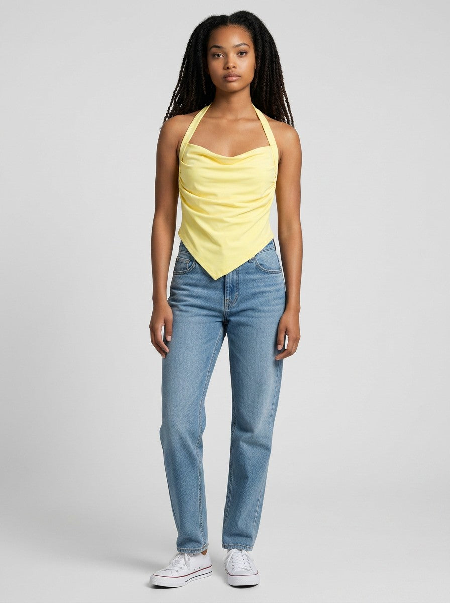 Model wearing a yellow EHG SmartWellness ruched halter neck yoga tank top with blue jeans and white sneakers.