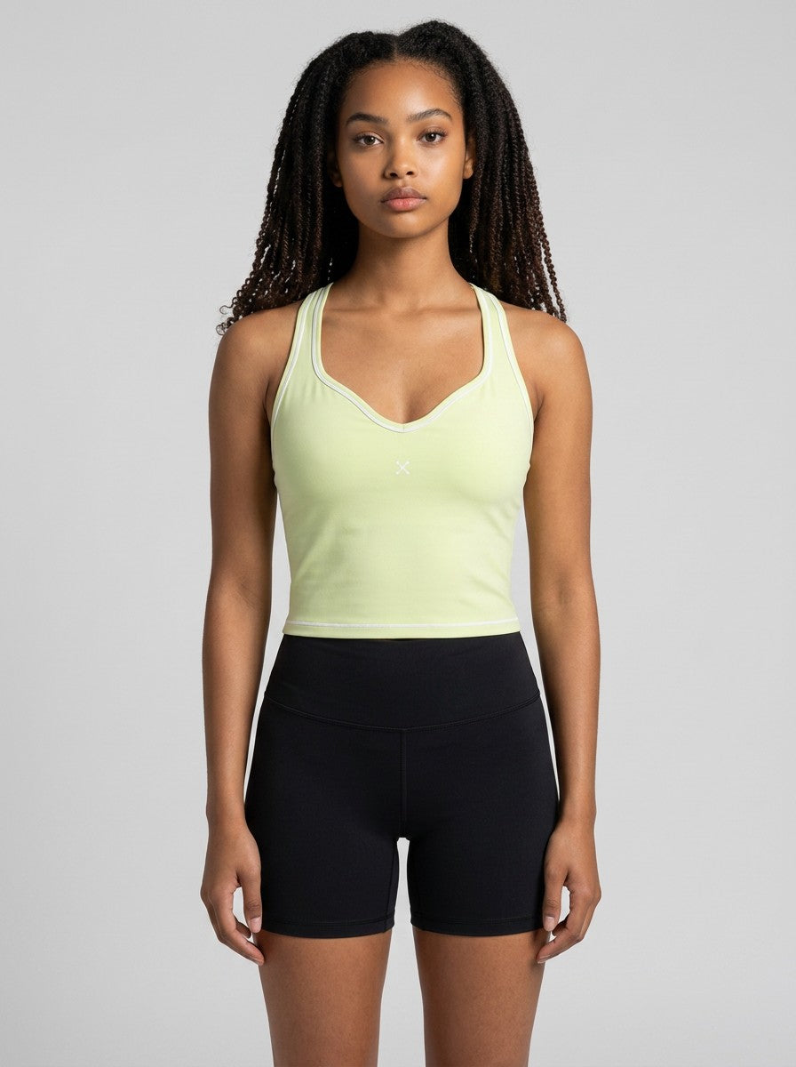 Model wearing EHG SmartWellness light yellow yoga tank top with U-neck, skinny straps, and visible topstitching.